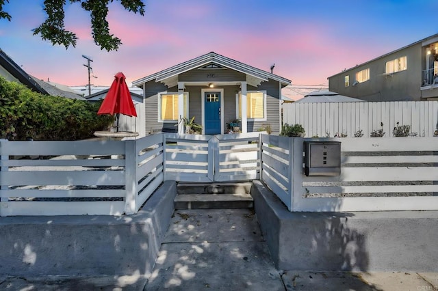 3721 Chamoune Ave, San Diego, CA 92105 - view of front facade with a fenced front yard and covered porch
