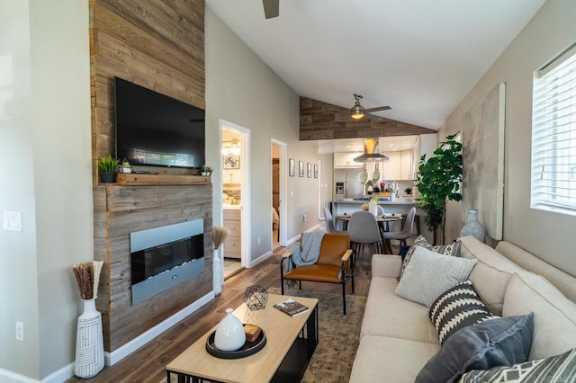 3721 Chamoune Ave, San Diego, CA 92105 - living area featuring a ceiling fan, a fireplace, wood finished floors, and high vaulted ceiling