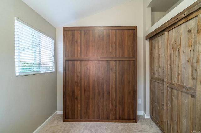 3721 Chamoune Ave, San Diego, CA 92105 - unfurnished bedroom with vaulted ceiling, carpet, a closet, and multiple windows
