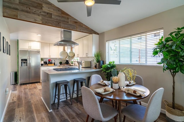 3721 Chamoune Ave, San Diego, CA 92105 - dining space with a ceiling fan, wood finished floors, and high vaulted ceiling