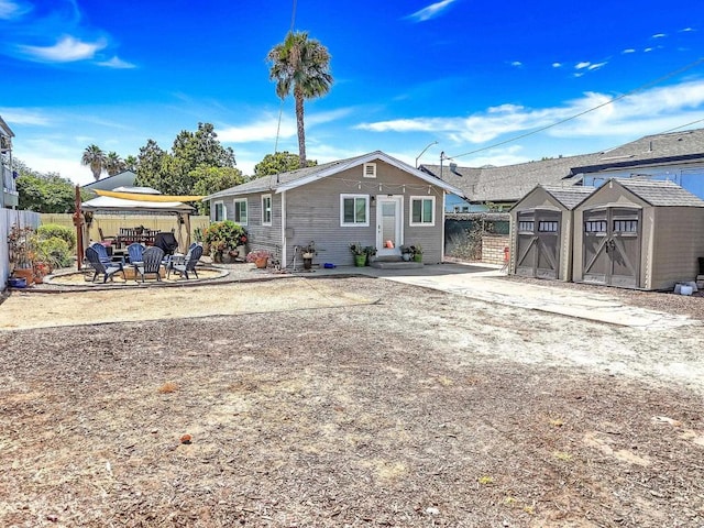 3721 Chamoune Ave, San Diego, CA 92105 - rear view of house featuring a storage unit, a gazebo, and a patio