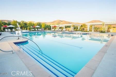 30106 Stargazer Way, Menifee, CA 92584 - community pool featuring a mountain view and a patio