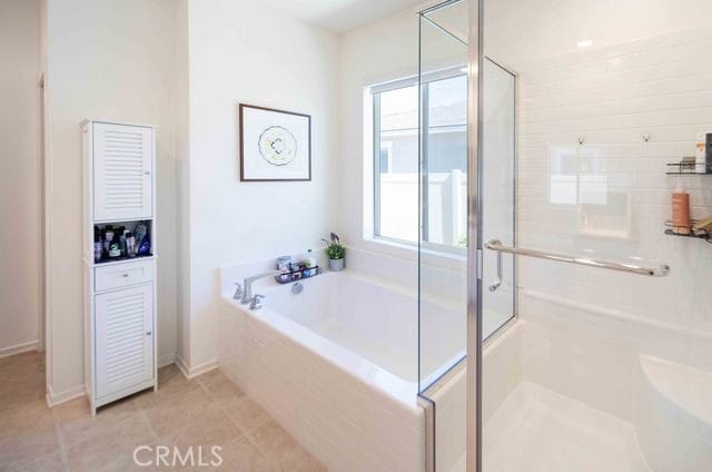 30106 Stargazer Way, Menifee, CA 92584 - full bathroom featuring a bath, a stall shower, and tile patterned flooring