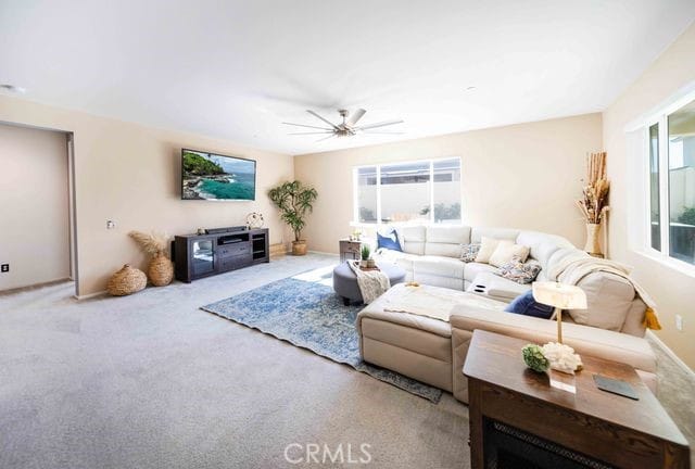 30106 Stargazer Way, Menifee, CA 92584 - carpeted living area with a ceiling fan and baseboards