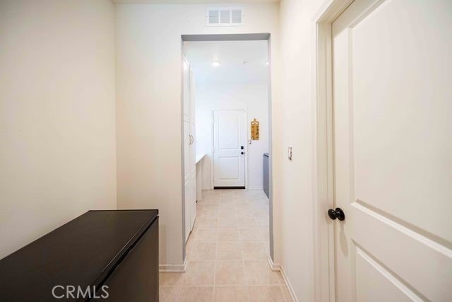 30106 Stargazer Way, Menifee, CA 92584 - hallway with light tile patterned floors