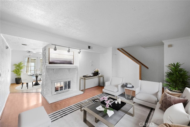 11903 Oertly Cir, Garden Grove, CA 92840 - living area with a textured ceiling, wood finished floors, a multi sided fireplace, and crown molding