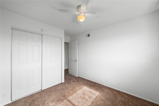 11903 Oertly Cir, Garden Grove, CA 92840 - unfurnished bedroom featuring carpet flooring, a closet, a textured ceiling, and a ceiling fan