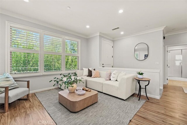 111 Thornhurst, Irvine, CA 92620 - living area with ornamental molding, light wood finished floors, and recessed lighting