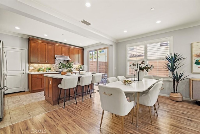 111 Thornhurst, Irvine, CA 92620 - dining space with ornamental molding, recessed lighting, and light wood-style flooring