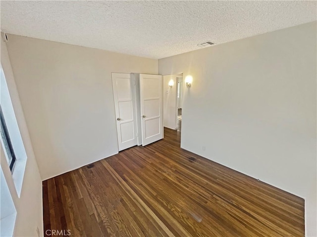 2334 N Keystone St, Burbank, CA 91504 - unfurnished room with dark wood-style floors and a textured ceiling