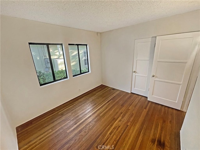 2334 N Keystone St, Burbank, CA 91504 - unfurnished bedroom featuring wood finished floors, a textured ceiling, and a closet