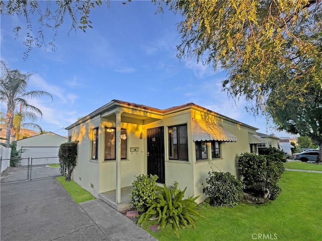 2334 N Keystone St, Burbank, CA 91504 - bungalow-style house with a gate, stucco siding, and a garage
