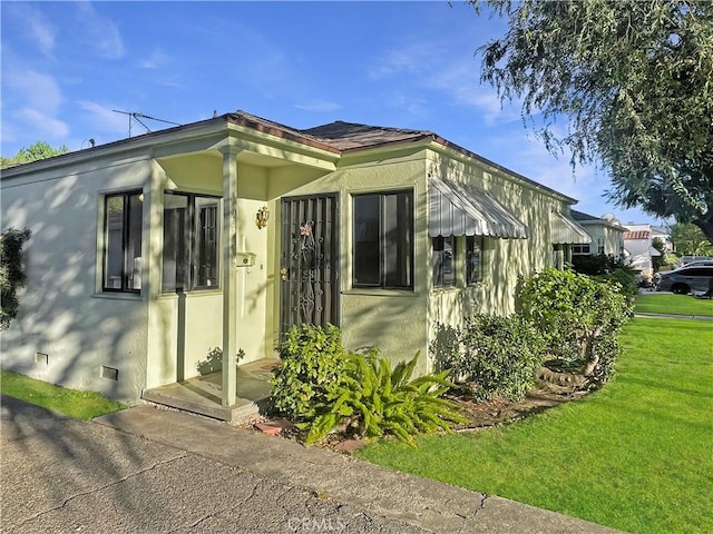 2334 N Keystone St, Burbank, CA 91504 - view of home's exterior with stucco siding and a lawn