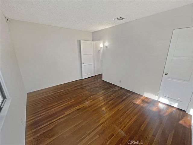 2334 N Keystone St, Burbank, CA 91504 - empty room featuring dark wood-type flooring and a textured ceiling