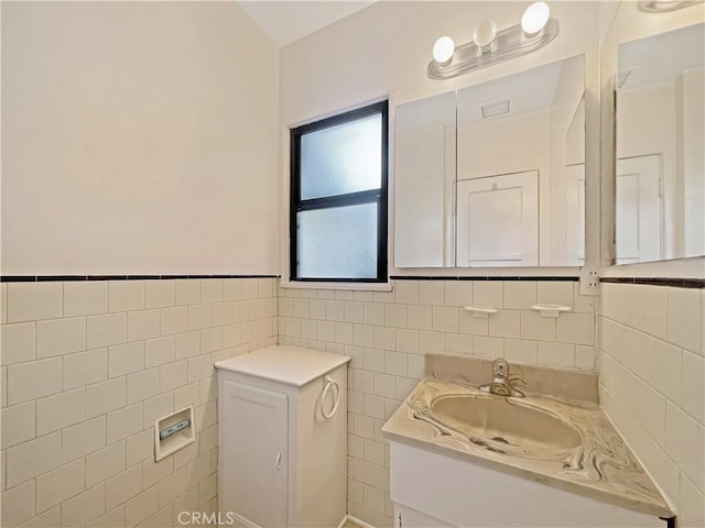 2334 N Keystone St, Burbank, CA 91504 - bathroom featuring vanity, tile walls, and a wainscoted wall