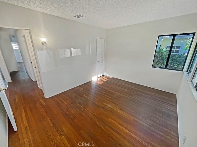 2334 N Keystone St, Burbank, CA 91504 - empty room featuring dark wood-style floors and a textured ceiling