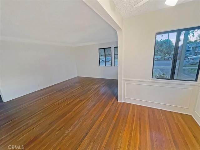 2334 N Keystone St, Burbank, CA 91504 - empty room with wood finished floors, ceiling fan, and a textured ceiling