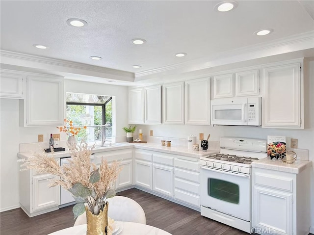 23 Thunder Trl Unit 12, Irvine, CA 92614 - kitchen featuring white appliances, dark wood-style floors, white cabinetry, light countertops, and crown molding