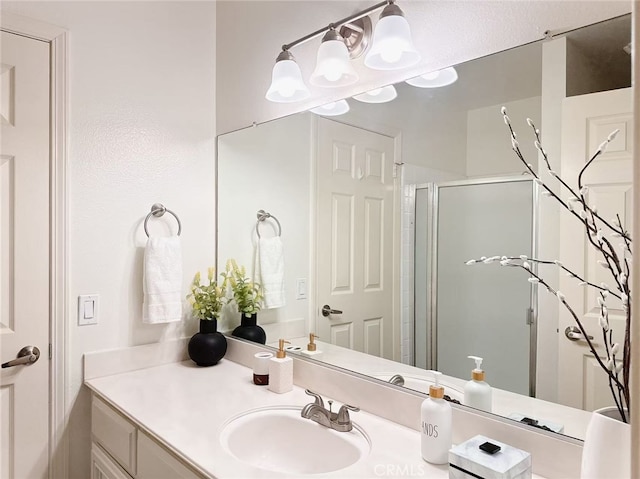 23 Thunder Trl Unit 12, Irvine, CA 92614 - full bathroom with a shower stall, vanity, and a chandelier