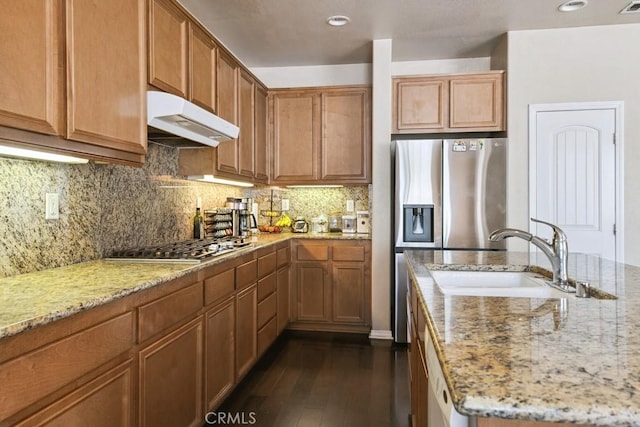 53085 Memorial St, Lake Elsinore, CA 92532 - kitchen with under cabinet range hood, stainless steel appliances, dark wood-type flooring, light stone countertops, and recessed lighting