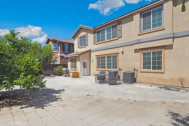 53085 Memorial St, Lake Elsinore, CA 92532 - rear view of property featuring stucco siding and a patio