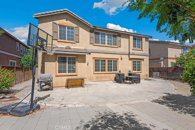 53085 Memorial St, Lake Elsinore, CA 92532 - back of house with stucco siding, a fenced backyard, a patio, and a tile roof