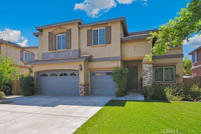53085 Memorial St, Lake Elsinore, CA 92532 - mediterranean / spanish-style home with stucco siding, an attached garage, a front lawn, concrete driveway, and brick siding