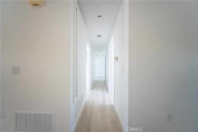 16520 Adelia St, Hesperia, CA 92345 - hallway with light wood-style floors and baseboards