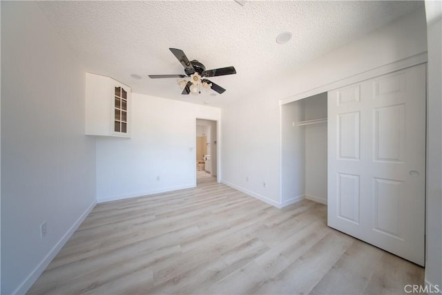 16520 Adelia St, Hesperia, CA 92345 - unfurnished bedroom with a textured ceiling, light wood finished floors, a closet, and a ceiling fan