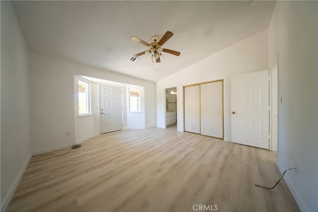 16520 Adelia St, Hesperia, CA 92345 - unfurnished bedroom with vaulted ceiling, light wood-type flooring, a closet, and ceiling fan