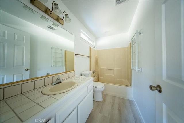 16520 Adelia St, Hesperia, CA 92345 - bathroom with vanity, wood finished floors, and tub / shower combination