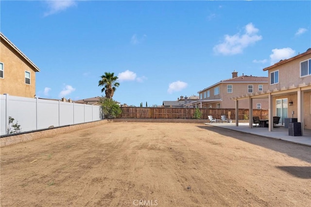 13695 Mesa Linda Ave, Victorville, CA 92392 - fenced backyard featuring a patio area and a residential view