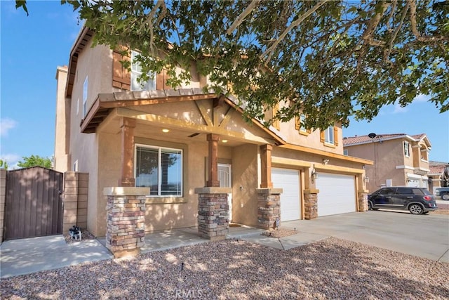 13695 Mesa Linda Ave, Victorville, CA 92392 - view of front of property featuring stucco siding, a gate, concrete driveway, and stone siding