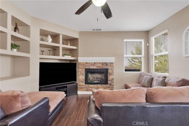 13695 Mesa Linda Ave, Victorville, CA 92392 - living area with dark wood-style floors, a ceiling fan, and a fireplace