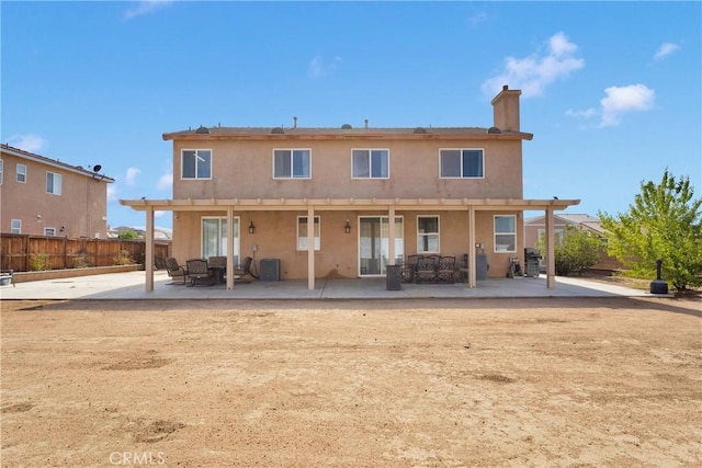 13695 Mesa Linda Ave, Victorville, CA 92392 - back of house with a patio area, stucco siding, a chimney, and an outdoor living space