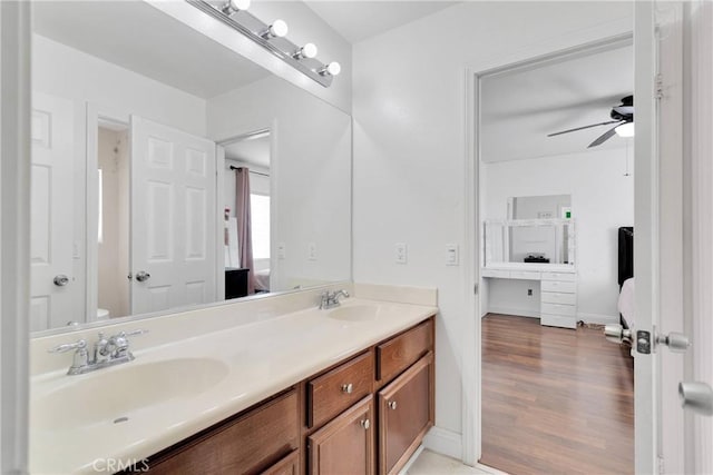 13695 Mesa Linda Ave, Victorville, CA 92392 - full bath featuring double vanity, ceiling fan, ensuite bath, and wood finished floors