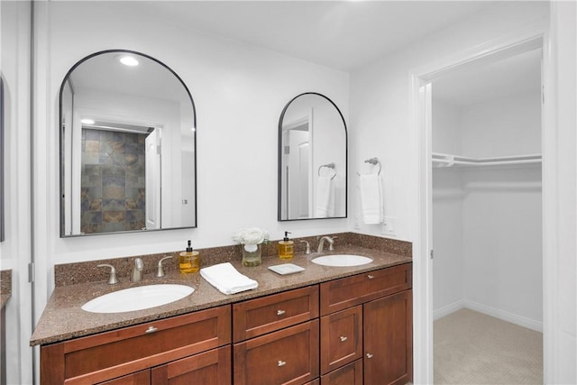 5042 Olympic Dr, Los Alamitos, CA 90720 - full bathroom with double vanity and a walk in closet