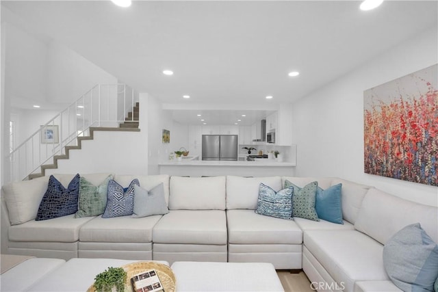 5042 Olympic Dr, Los Alamitos, CA 90720 - living area featuring recessed lighting, stairway, and wood finished floors