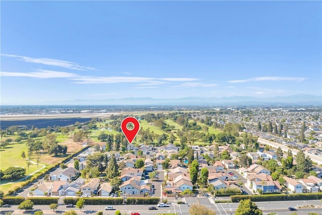 5042 Olympic Dr, Los Alamitos, CA 90720 - aerial overview of property's location with mountains and nearby suburban area