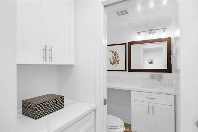 5042 Olympic Dr, Los Alamitos, CA 90720 - bathroom featuring vanity and toilet