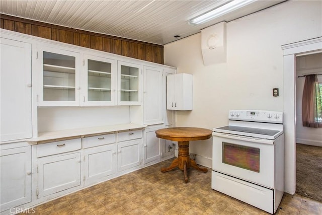 559 Edgar Ave Unit A2-282, Beaumont, CA 92223 - kitchen with white range with electric stovetop, white cabinets, glass insert cabinets, light countertops, and tile patterned floors