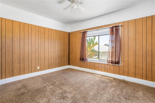 559 Edgar Ave Unit A2-282, Beaumont, CA 92223 - carpeted empty room with a ceiling fan and wood walls