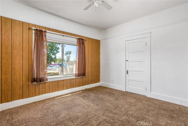 559 Edgar Ave Unit A2-282, Beaumont, CA 92223 - unfurnished room with carpet flooring, a ceiling fan, and wooden walls