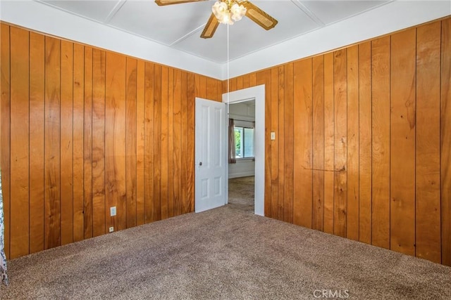 559 Edgar Ave Unit A2-282, Beaumont, CA 92223 - empty room with ceiling fan, carpet floors, and wooden walls
