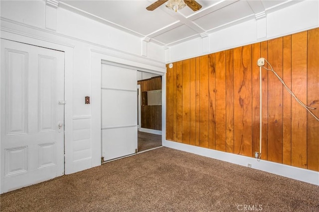 559 Edgar Ave Unit A2-282, Beaumont, CA 92223 - unfurnished bedroom with carpet floors, a closet, wooden walls, and a ceiling fan