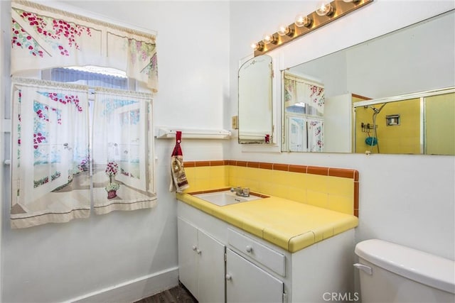 559 Edgar Ave Unit A2-282, Beaumont, CA 92223 - full bathroom with vanity, an enclosed shower, wood finished floors, and tasteful backsplash