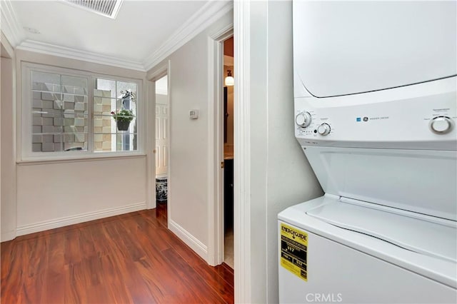 741 Avenida Majorca Unit B, Laguna Woods, CA 92637 - laundry room with estacked washer and dryer, dark wood-style flooring, and crown molding