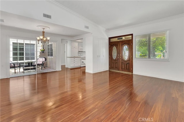 741 Avenida Majorca Unit B, Laguna Woods, CA 92637 - entryway featuring a chandelier, ornamental molding, and wood finished floors