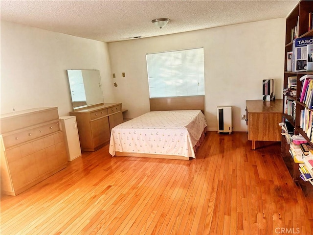 917 N Olive Ave, Alhambra, CA 91801 - bedroom featuring light wood-style floors and a textured ceiling