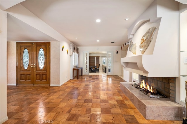 18409 Los Alimos St, Porter Ranch, CA 91326 - foyer featuring a multi sided fireplace and recessed lighting